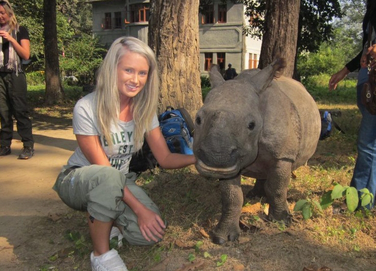 Tempe Parnell with a baby rhino in Nepal