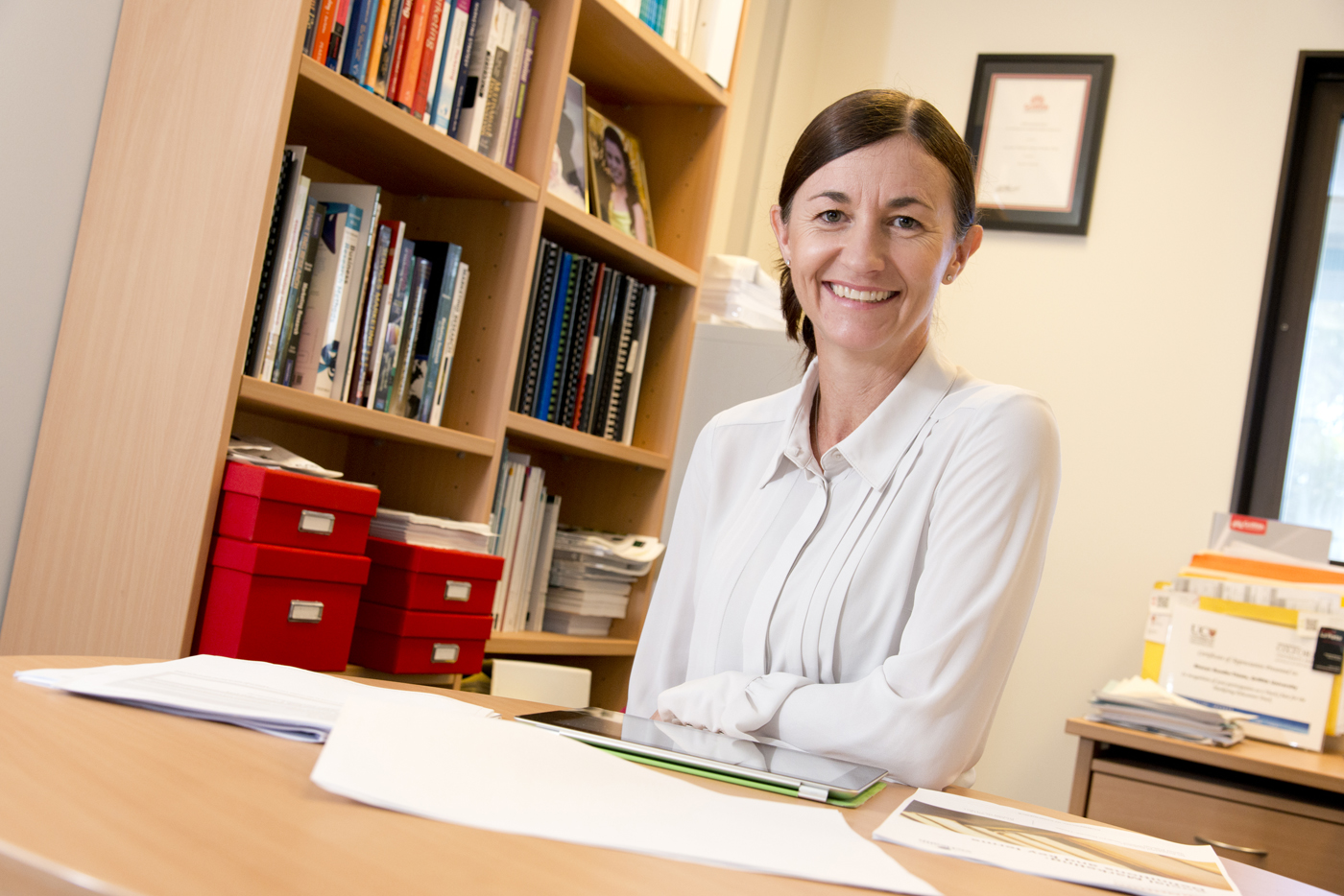 Griffith academic Sharyn Rundle-Thiele sits behind her office desk.