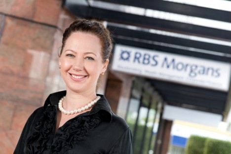 Head and shoulders of Felicity Cooper, with RBS Morgans sign in background
