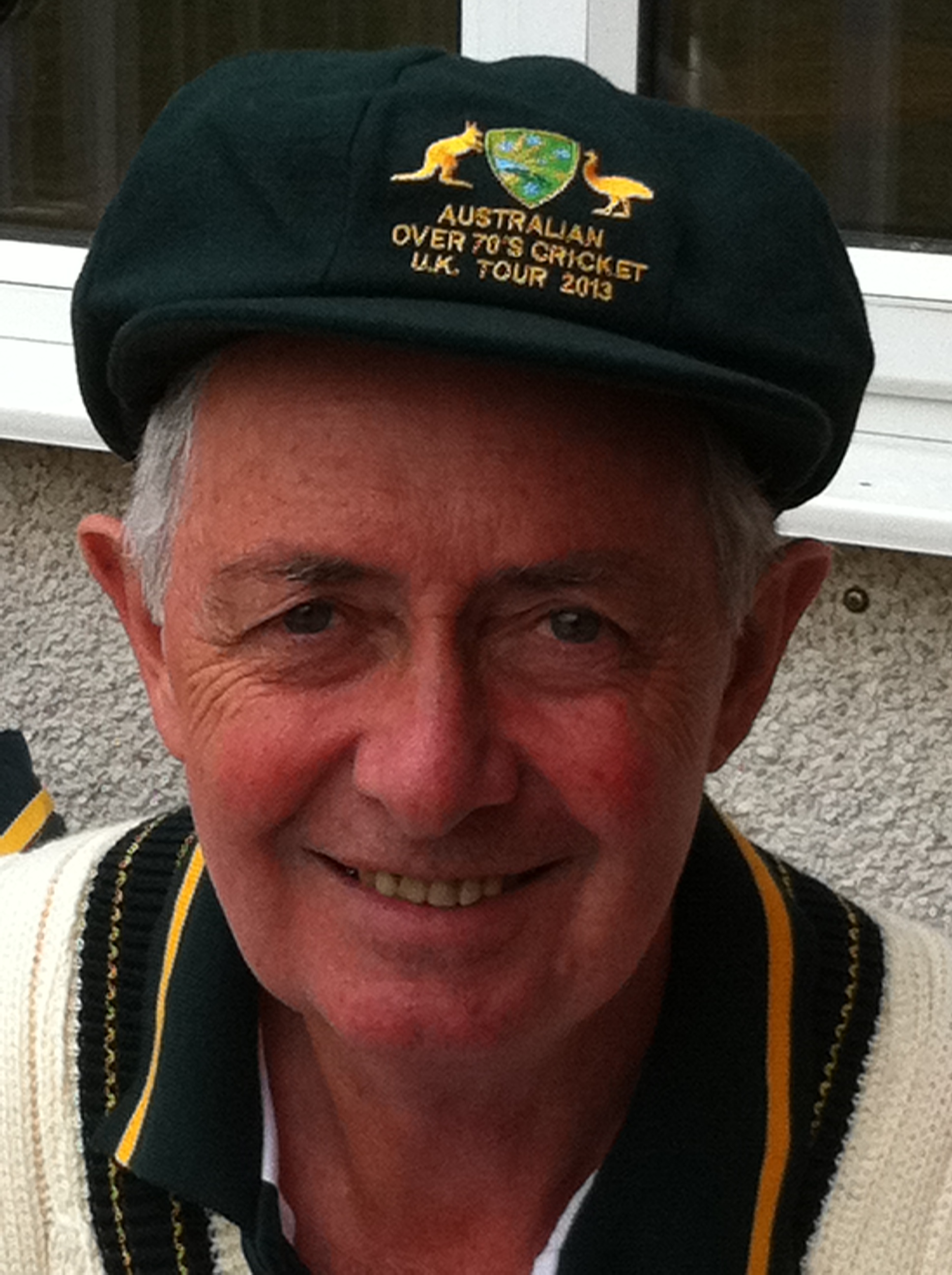 Photos of Professor Ian Lowe wearing an baggie green cricketing cap