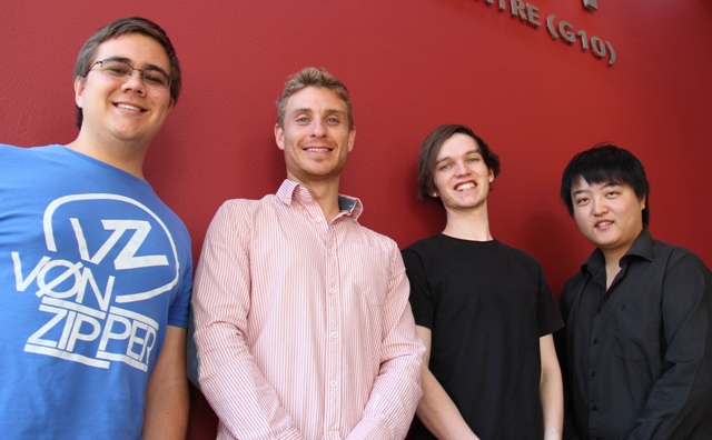 Red background, four Griffith business students in foreground