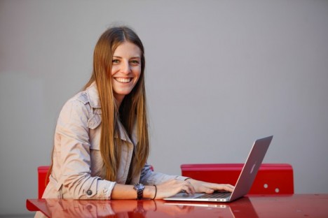 Lucy Frank, Griffith business student, sitting in front of laptop