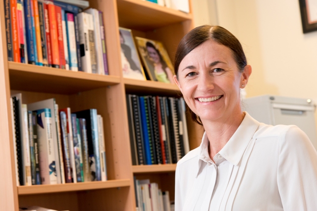 Head and shoulders of Sharyn Rundle-Thiele, Griffith University, in front of a bookcase.