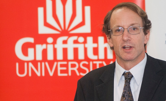 Headshot of AJ Brown, Centre for Governance and Public Policy, with Griffith University logo as backdrop.