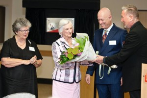 Professor William MacNeil (Dean and Head of Griffith Law School) presents flowers to Mrs Alison Kearney DUniv.
