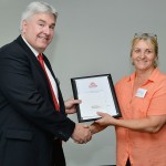 Tracey McCann receives her award from Paul Mazerolle