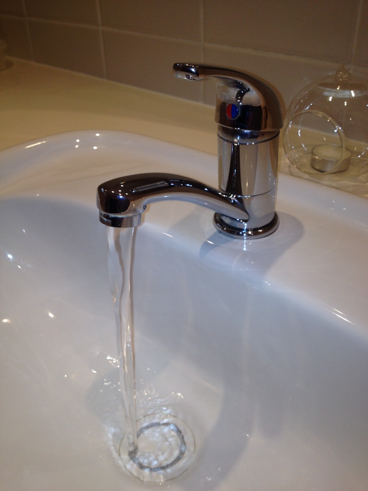 Tap runing water into a hand basin