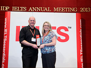 Brett Archer and Pamela Humphries accepting the Performance Excellence Award on behalf of the Griffith English Language Institute for its commitment to quality English language testing.