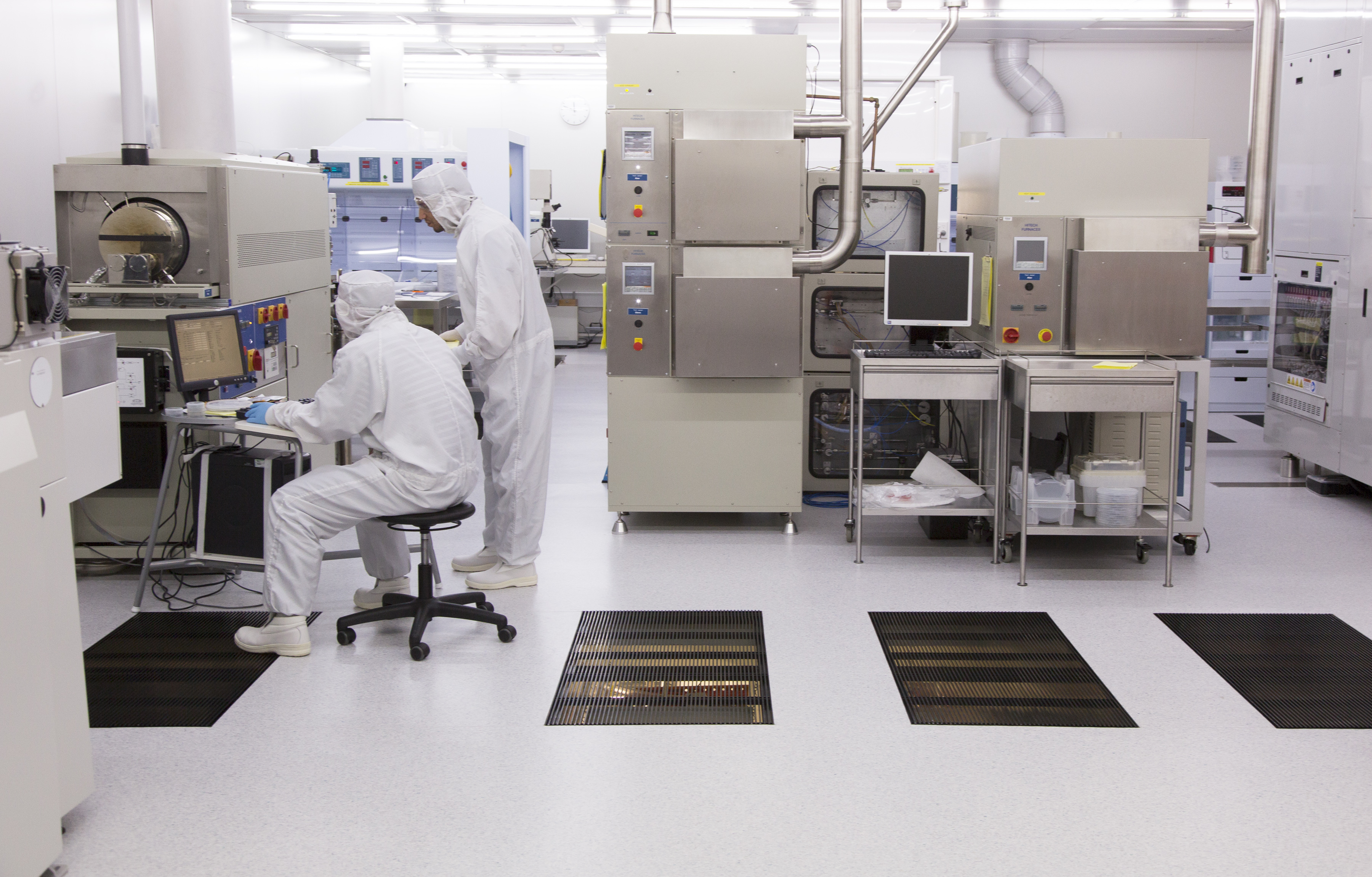 Scientists at work in the Queensland Microtechnology Facility clean room
