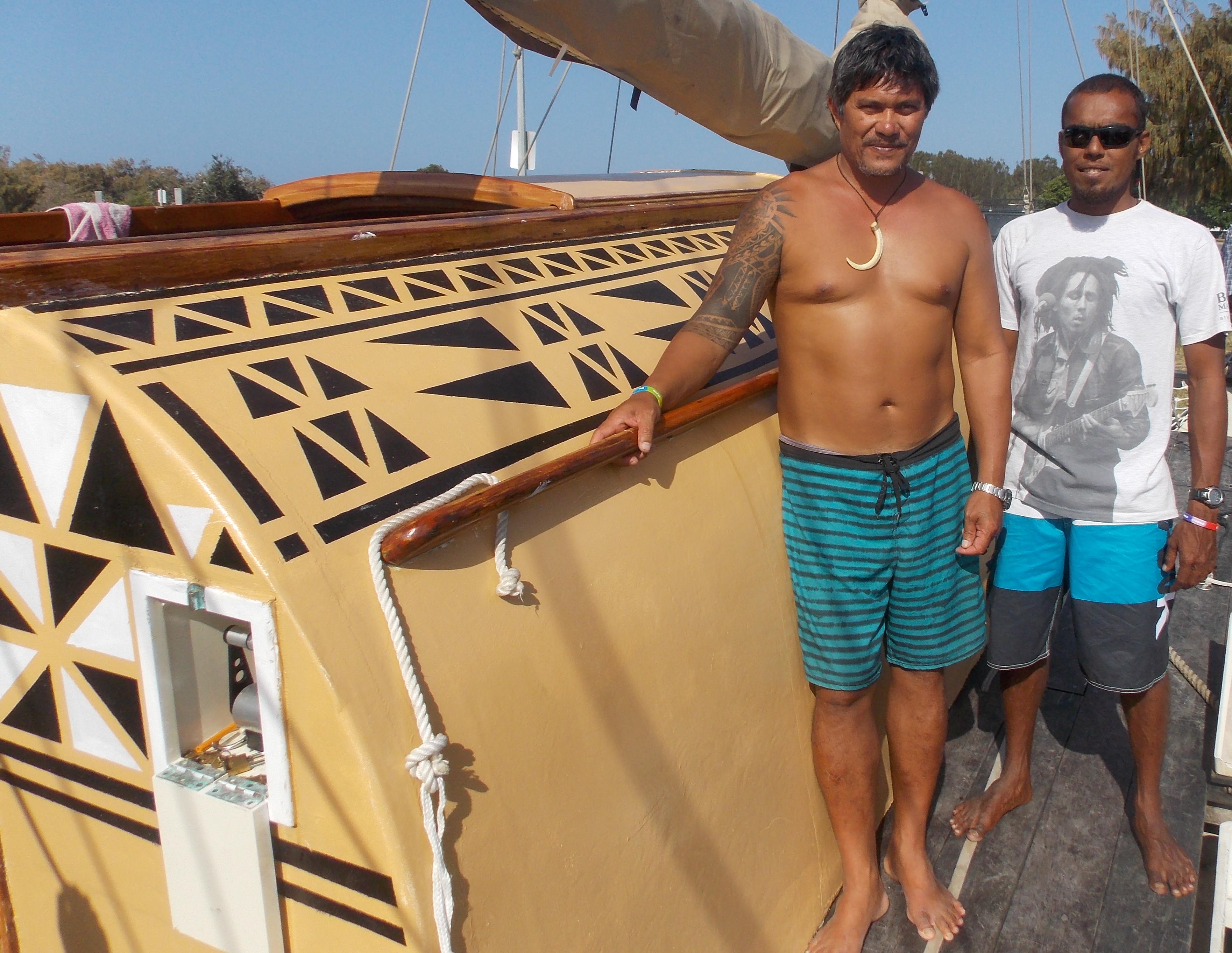 Pacific Islander sailors Peia Patai and Angelo Smith aboard a traditional ocean canoe