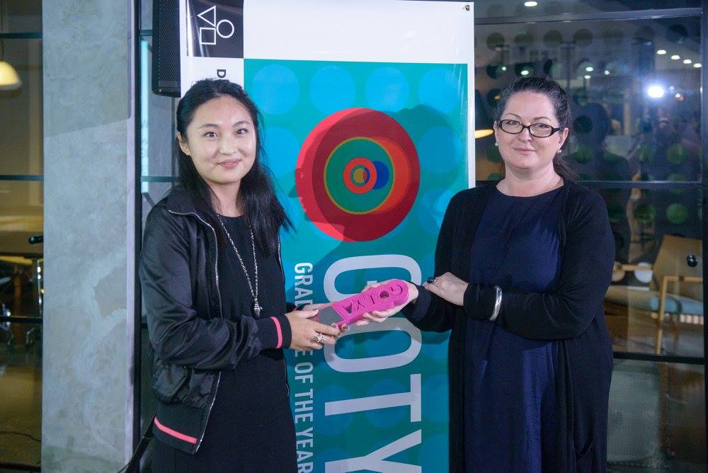 Angela Fok is presented with her award after winning the GOTYA 2015 for Jewellery Design. Image credit: Michael Warrington of Warrington Photography.