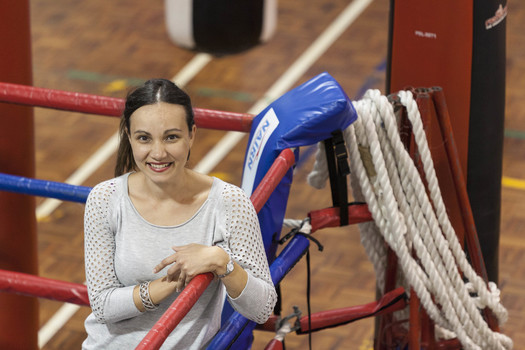 Griffith University's Caroline Riot photographed inside a boxing ring