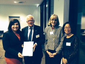 Prof Ron Quinn receives his award from the Honourable Leeanne Enoch