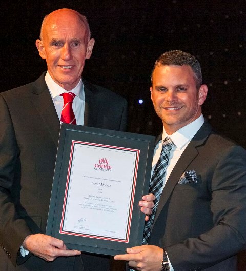2014 Young Outstanding Alumnus David Morgan accepts his award from Pro Vice Chancellor (Business), Professor Michael Powell.