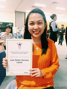 A vibrant international student Lyle Libuit, from the Philippine’s donning her certificate with a big smile.