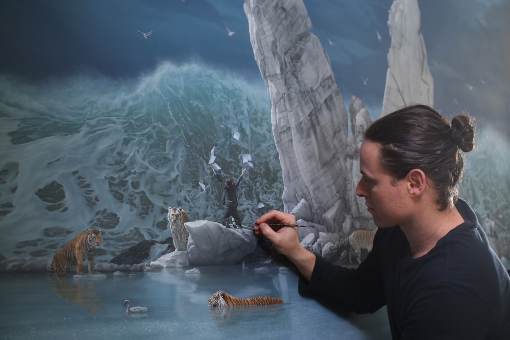 Joel Rea with his painting The Promised Land