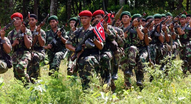 A group of military soldiers in uniform in Aceh region, Indonesia.
