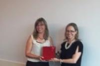 Ms Rhonda Friesen and Ms Heidi Piper exchanging gifts