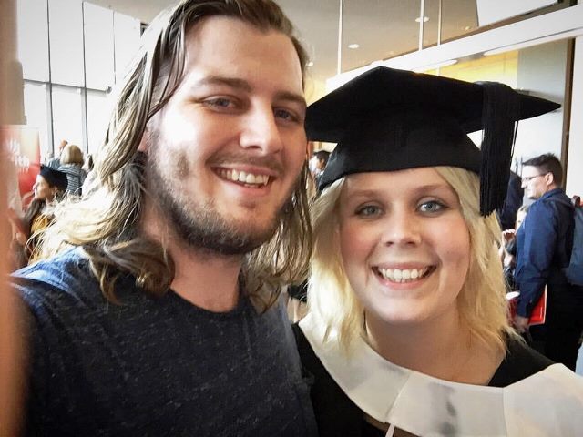 Danielle Redford, with husband Jonathan, at her graduation ceremony.