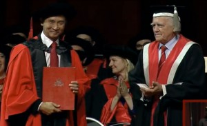 Li Cunxin accepts his Honorary Doctorate from Chancellor Henry Smerdon AM.