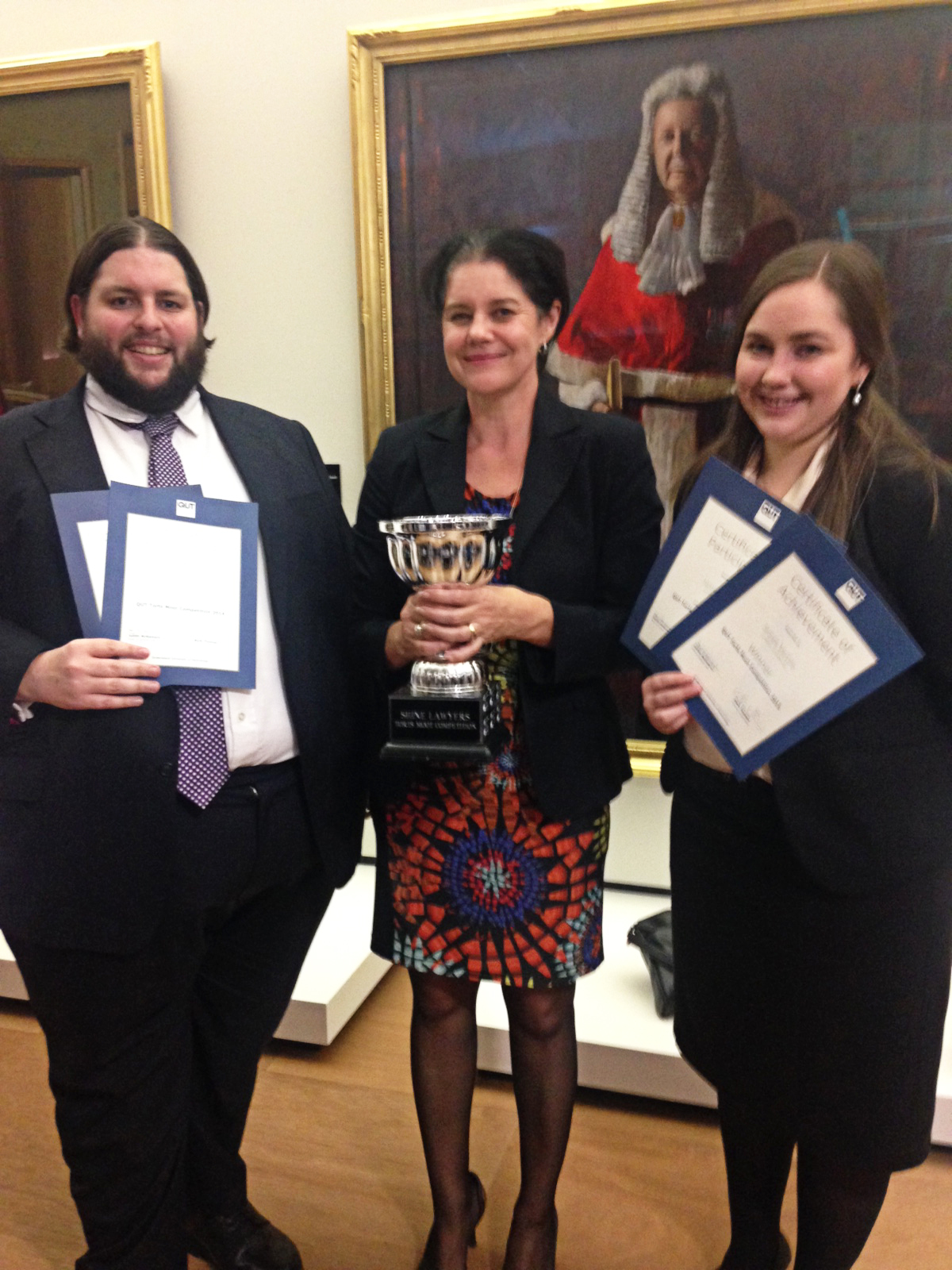 Moot winners James Vercoe and Charlotte Roache with coach Dr Kylie Burns (centre)