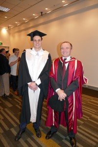 Master of Finance and Investments graduate Andrew Hack with Professor David Grant