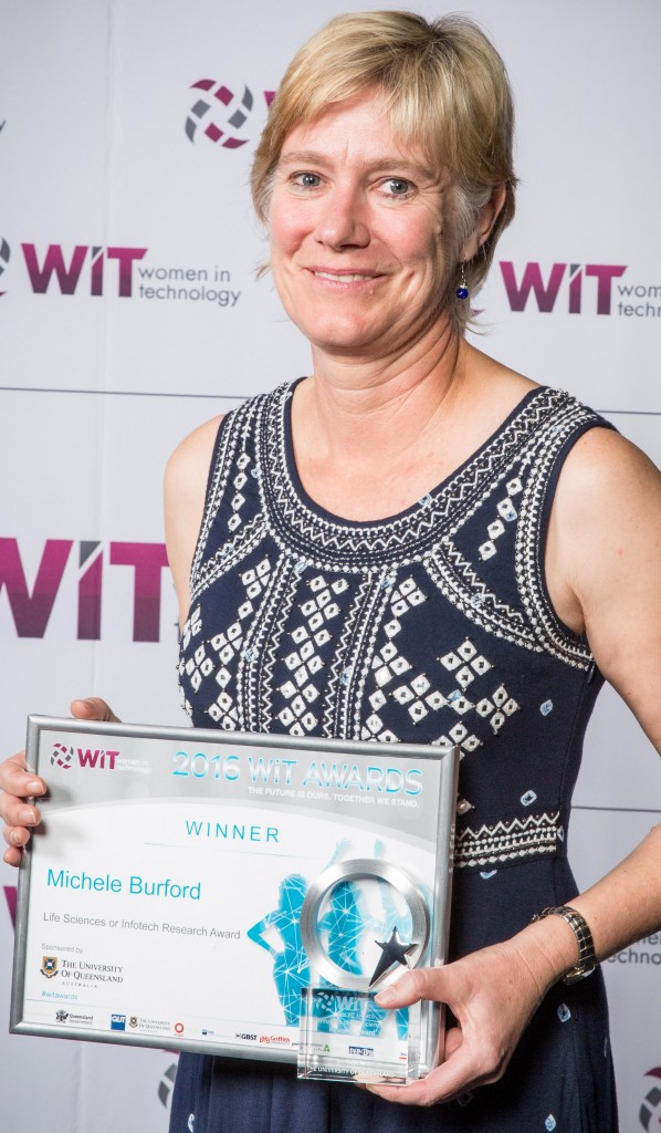 Professor Michelle Burford with her award for Life Science and ICT Research