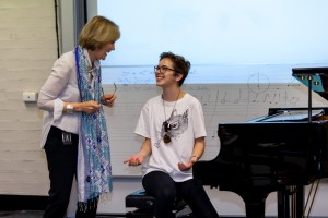 Professor Gemma Carey encourages a student with their performance