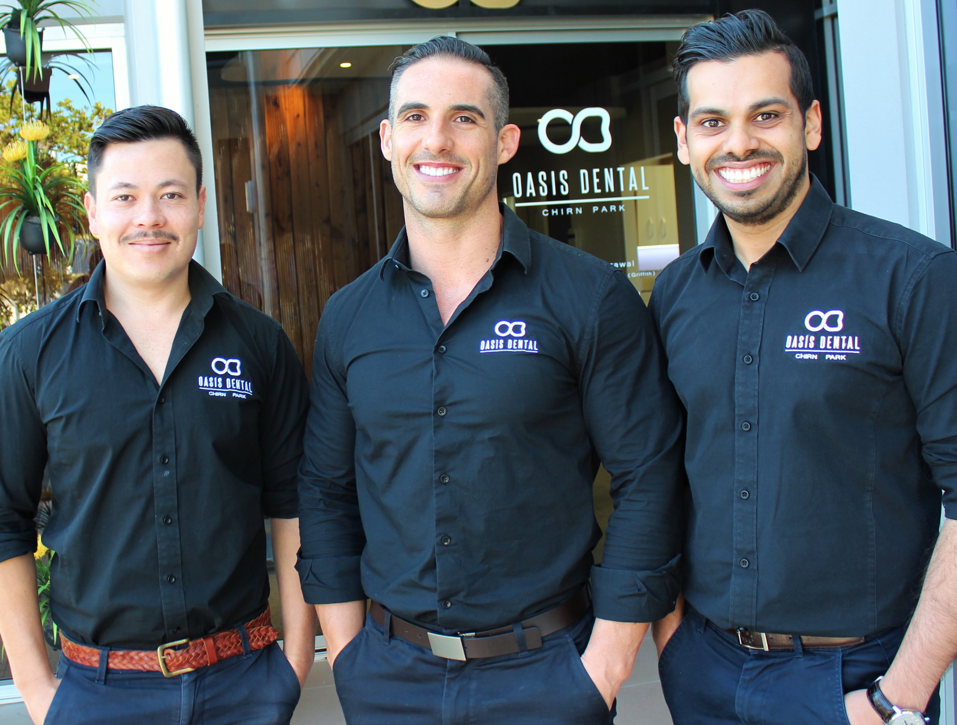 Outside their dental clinic: Oasis Dental Studio partners, from left, David Ashford, Andrew Firgaira and Bharat Agrawal