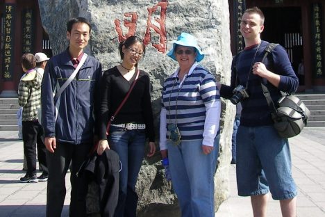 Griffith alumnus and community educator Judy Staggs with family and friends in China