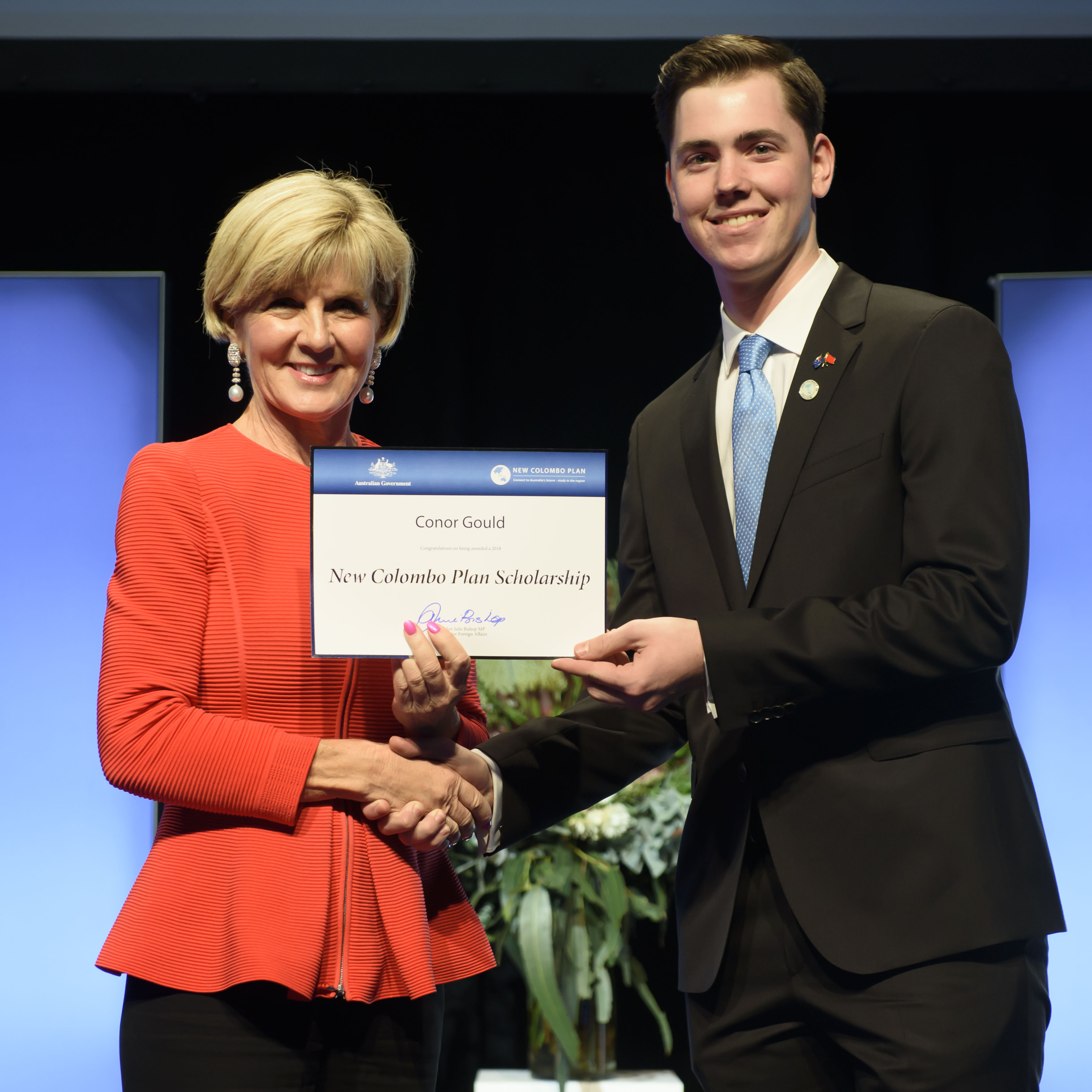 Conor Gould, pictured receiving the 2018 New Colombo Plan China Fellow Award from Foreign Minister Julie Bishop, is facing a new challenge in New Zealand this week.