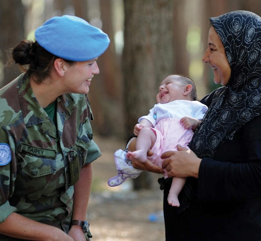 UN peacekeeper and Lebanese woman and child: Image from the cover of Vanessa Newby's book, Peacekeeping in South Lebanon