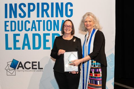 Professor Donna Pendergast receives her award from ACEL Qld Branch President Deborah Kember.