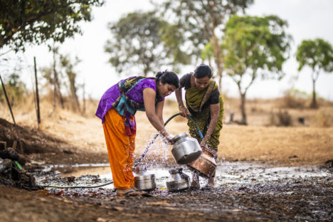 Women filling water at a remote water station near the Palshin village in the outskirts of northern Mumbia. Finding drinking water is a daily struggle for many people in India where more than 600 million people face serous water shortages. Picture Dylan Crawford/the Water Story