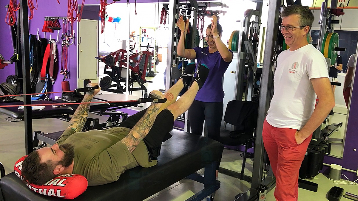 Associate Professor James St John, head of the Clem Jones Centre for Neurobiology and Stem Cell Research with exercise physiologist Meg Wilcox and client Dan Eiser.