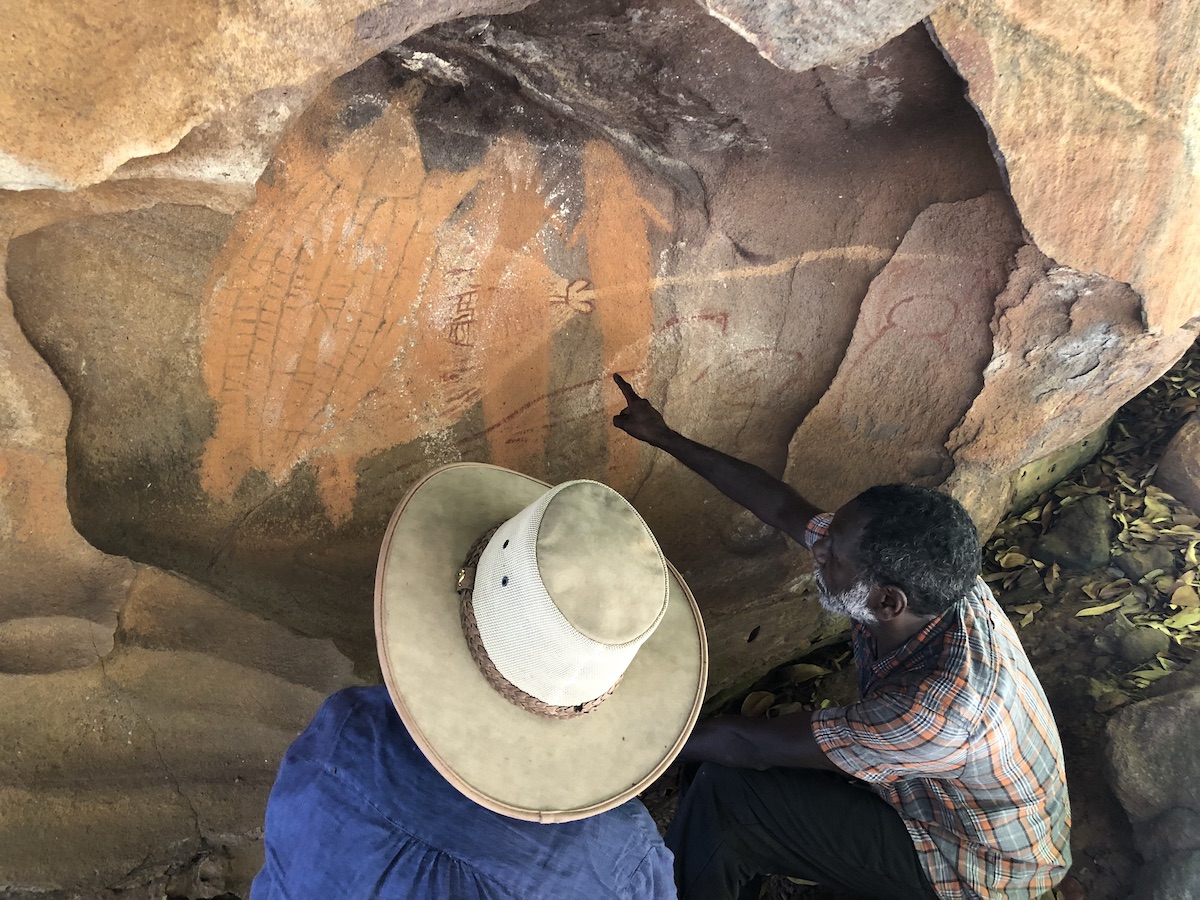 Traditional Owner Anthony Harrigan from the Waarnthuurr-iin Aboriginal Corporation showing researcher Noelene Cole some of the motifs in his country.