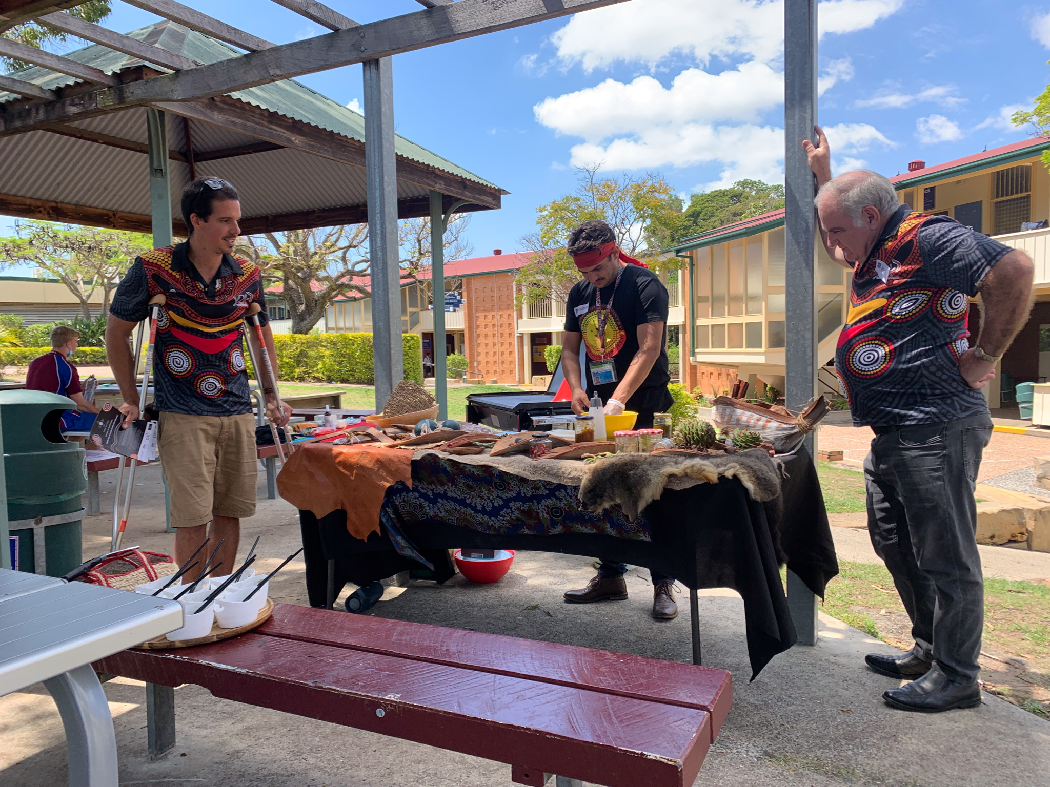 Three people prepare for a yarning circle activity