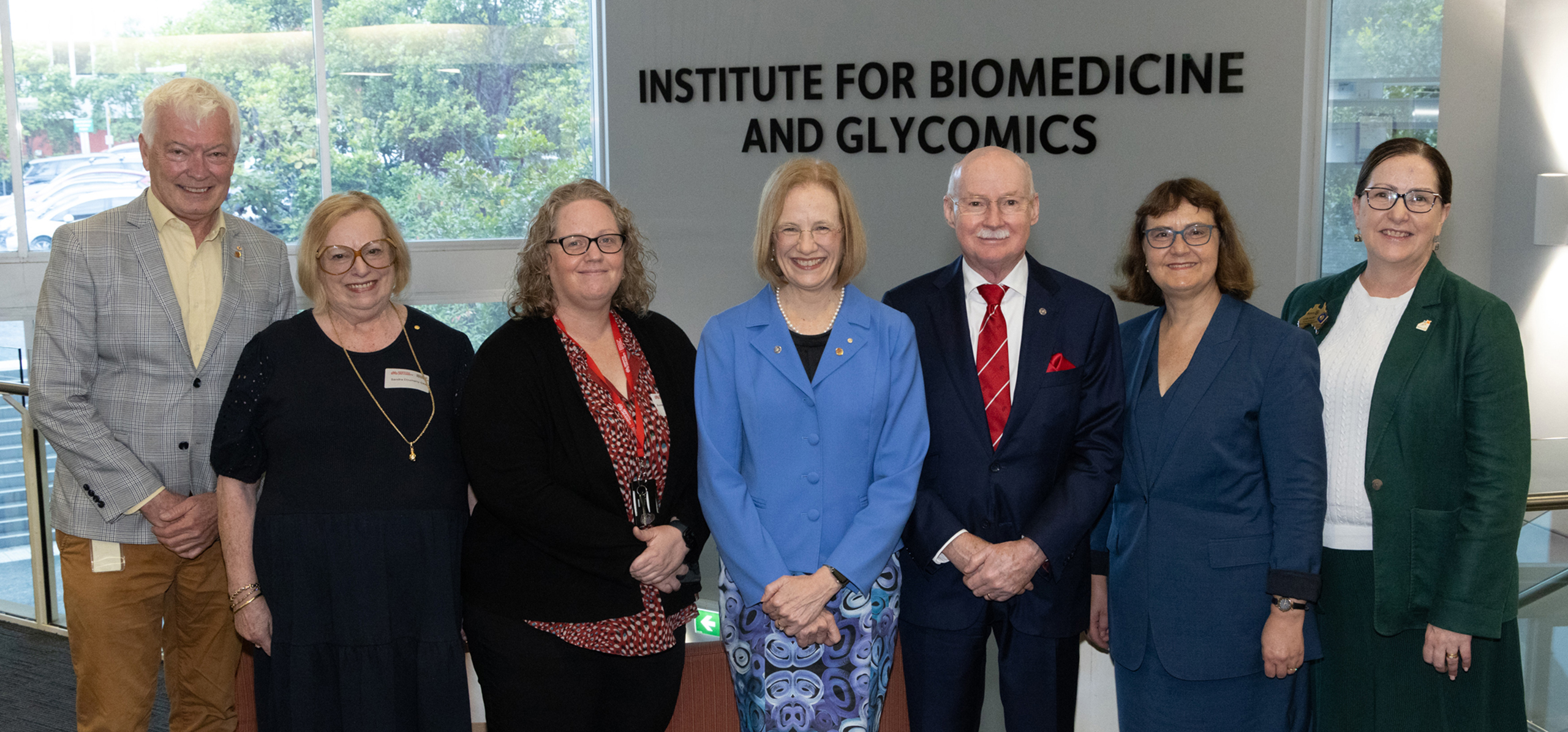 Photo of delegates standing in Institute for Biomedicine and Glycomics reception area