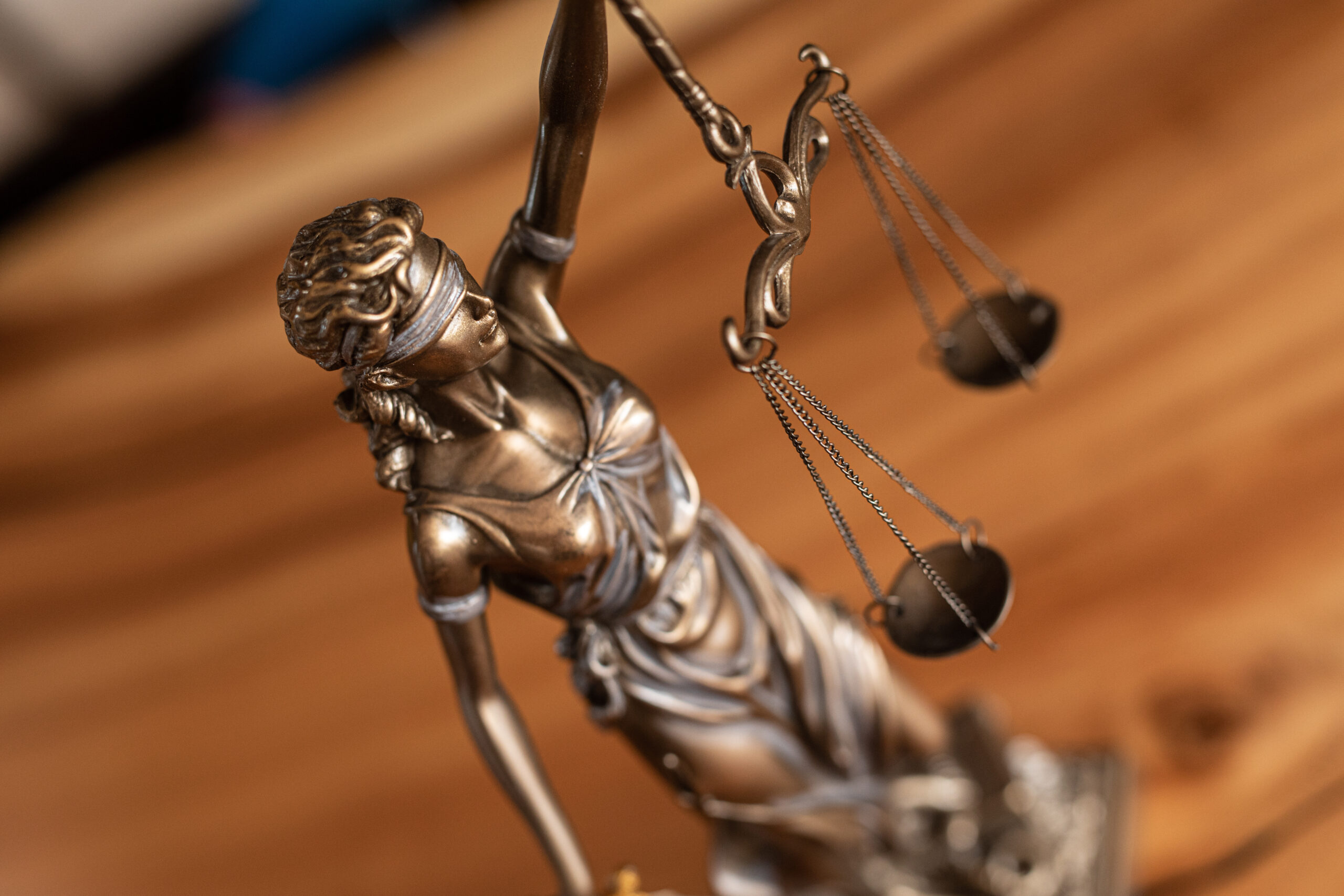 A photo of a statue depicting the balance of law and justice