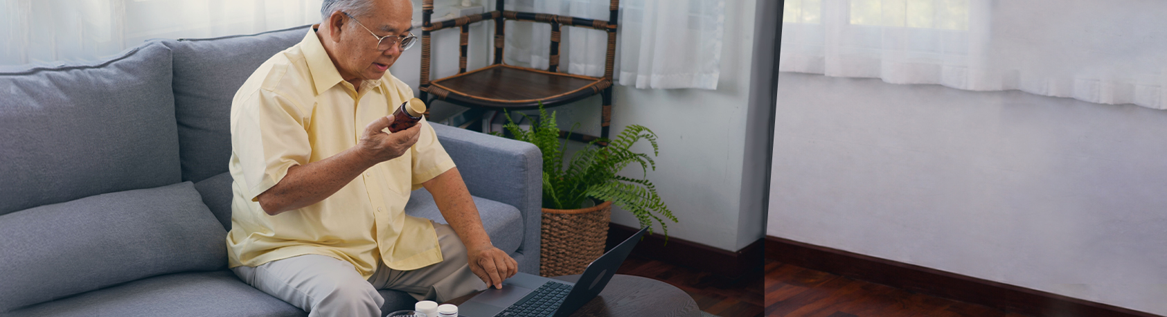 Elderly gentleman checking medication on computer