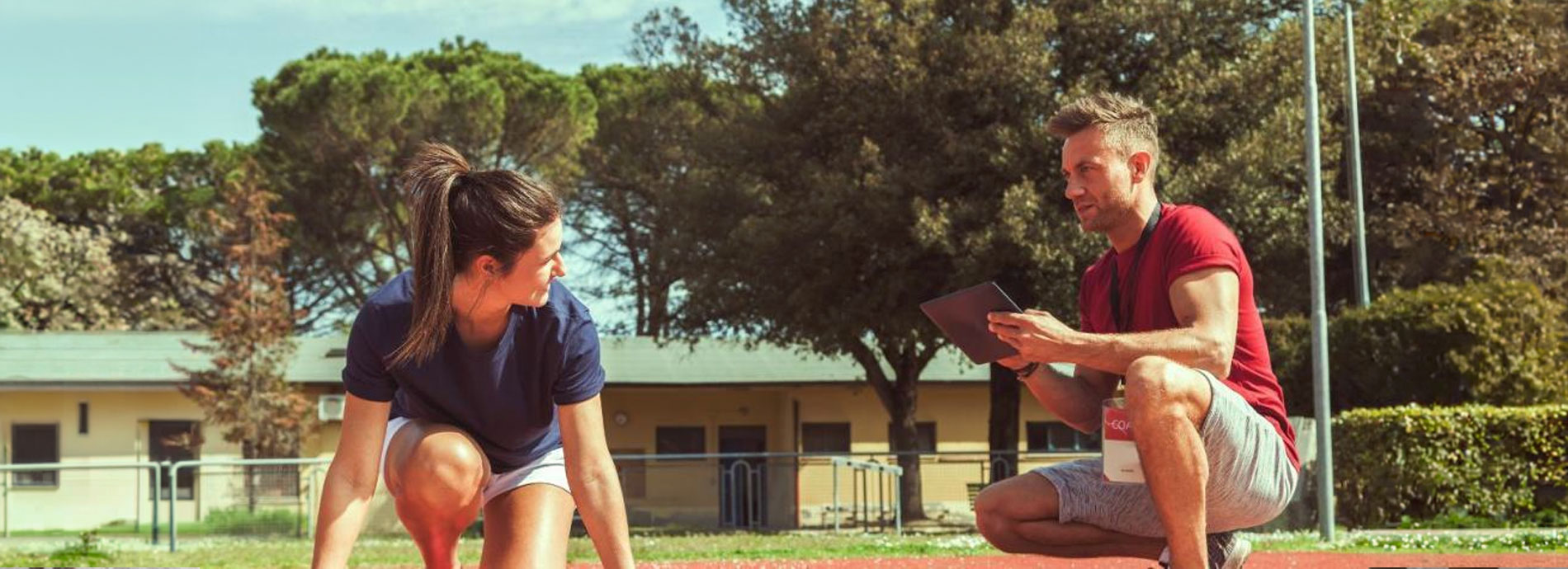 Coach and runner at the track